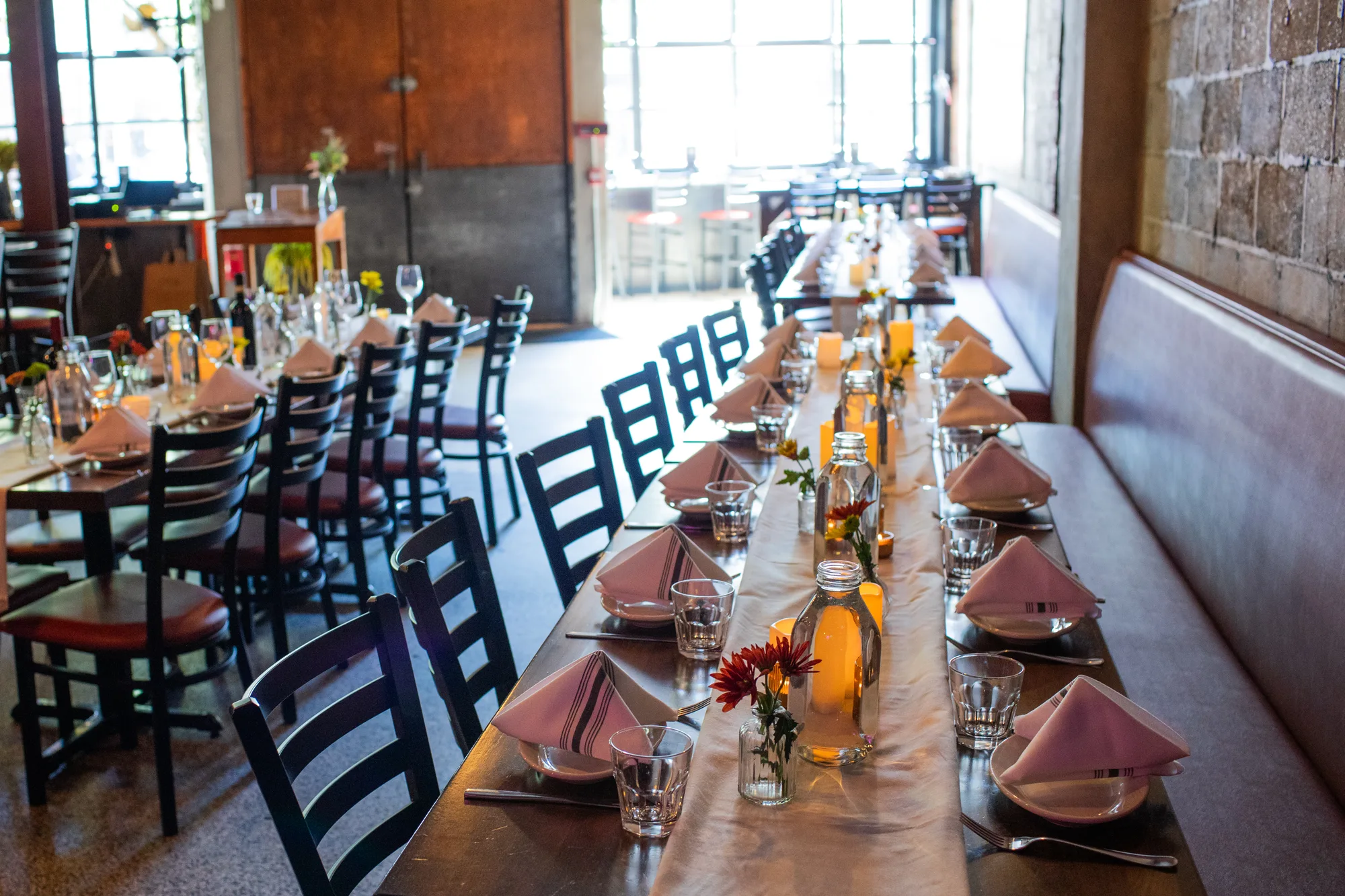 A sunlit long table dressed for a celebration