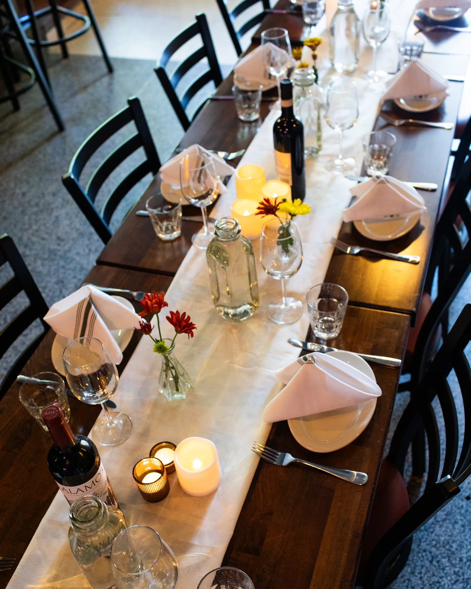 An oversized reservation table set with candles and flowers